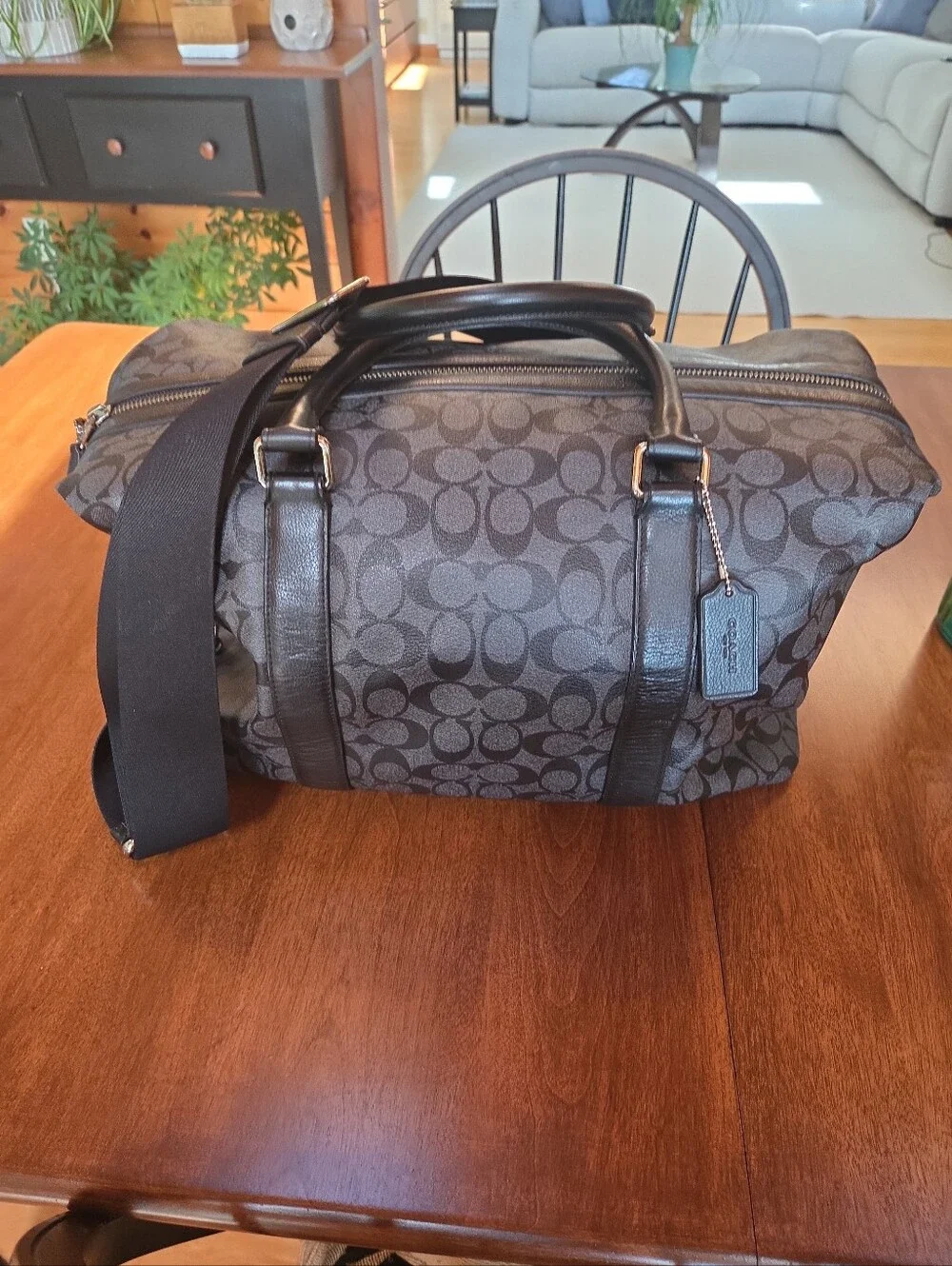 Coach Black Signature Leather Weekender tote bag dark gray and black.